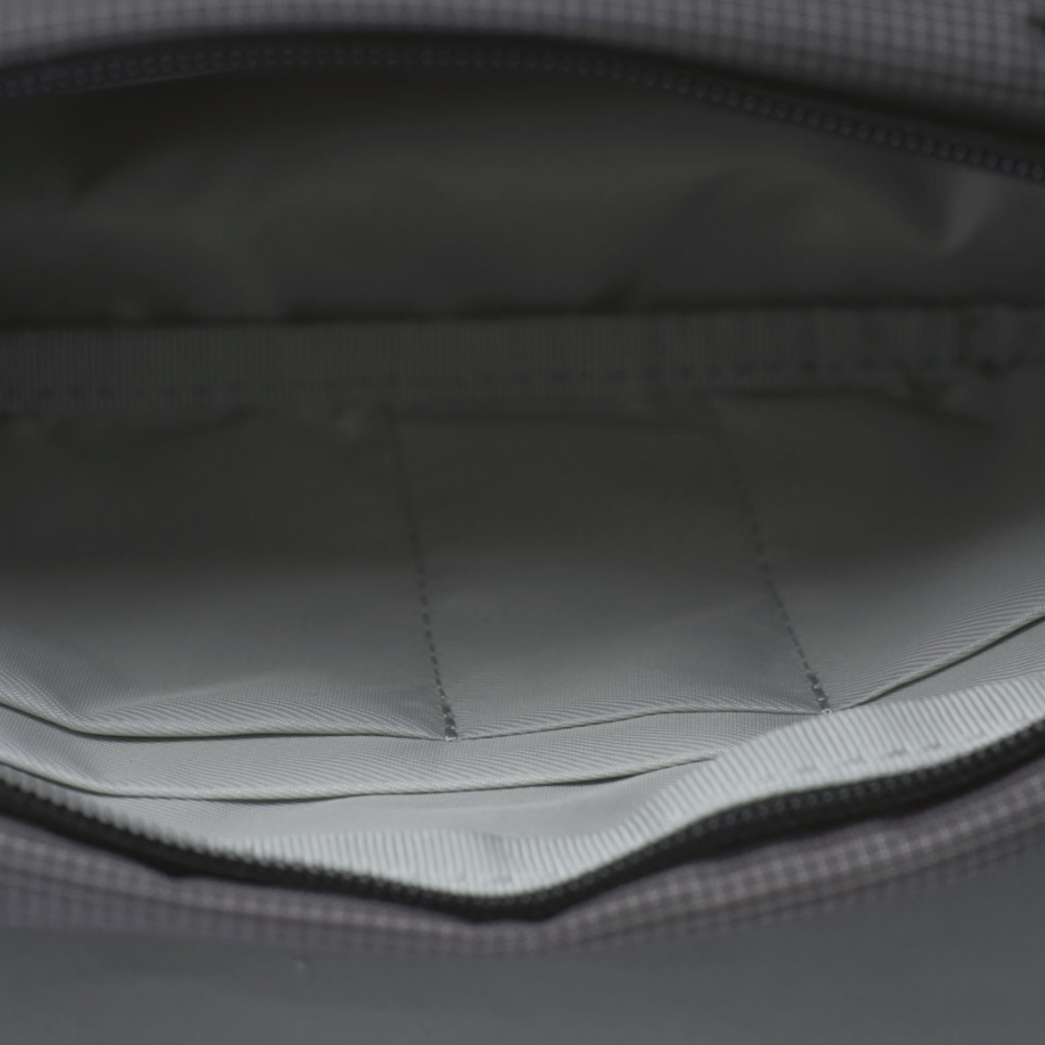 Overhead view of inner separate compartments in NIID N1 sling bag, neat layers to organize different personal belongings clearly.
