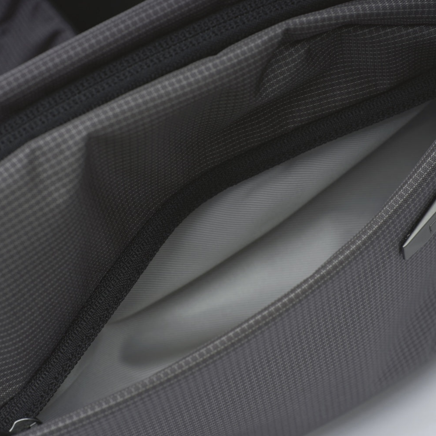 Inner auxiliary pocket closeup of NIID N1 sling bag, soft lining fabric to protect mobile phone and valuable small gadgets.