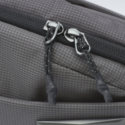 Close up metal zipper pull tab of NIID N1 sling bag, sturdy woven rope pull for easy opening and long time usage.