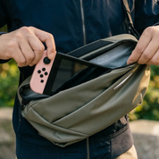 NIID N1L modular sling bag carrying Nintendo Switch, ideal portable storage solution for gamers and outdoor travelers on the go.