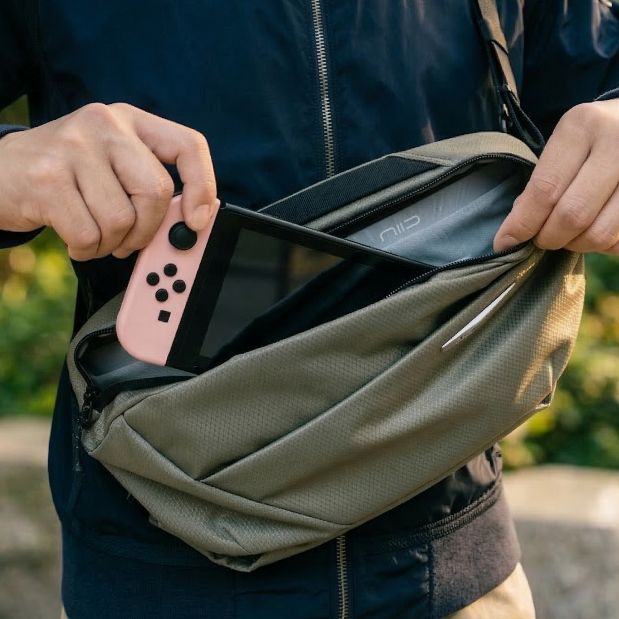 NIID N1L modular sling bag carrying Nintendo Switch, ideal portable storage solution for gamers and outdoor travelers on the go.