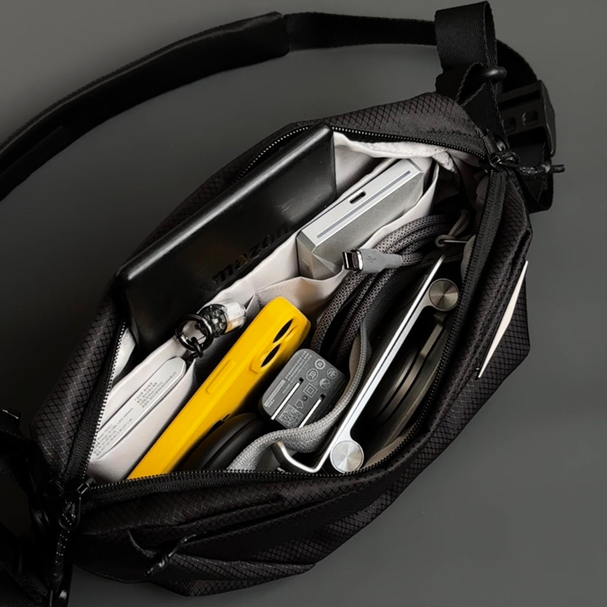 NIID NEO Nomad 4L Sling Bag in Black - Open Inner Compartment Layout Display with Tech EDC and Accessories