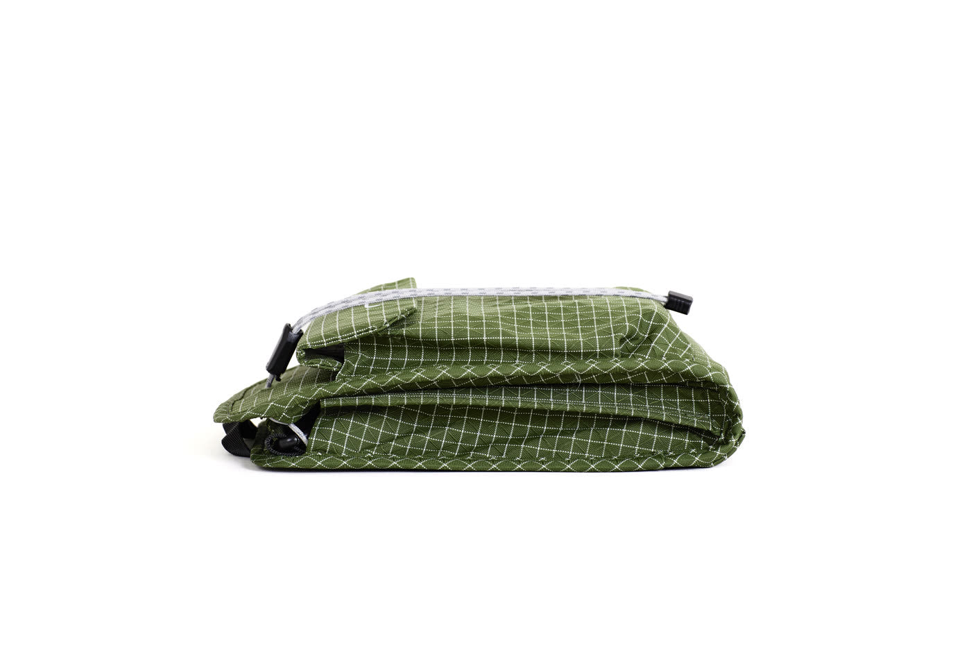 NIID NEO Nomad Pouch Pine Green Ripstop pouch, white grid ripstop fabric with drawstring closure, horizontal side angle shot on clean white background.