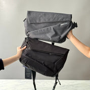 Two NIID Radiant premium technical sling bags held together against a plain background, demonstrating the modular combination architecture and sleek design tailored for urban professional digital nomads.