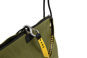NIID ST@TEMENT S7 Tote Bag Khaki/Olive close-up of branded yellow webbing strap and metal carabiner hardware, premium accessory detail shot on white background.