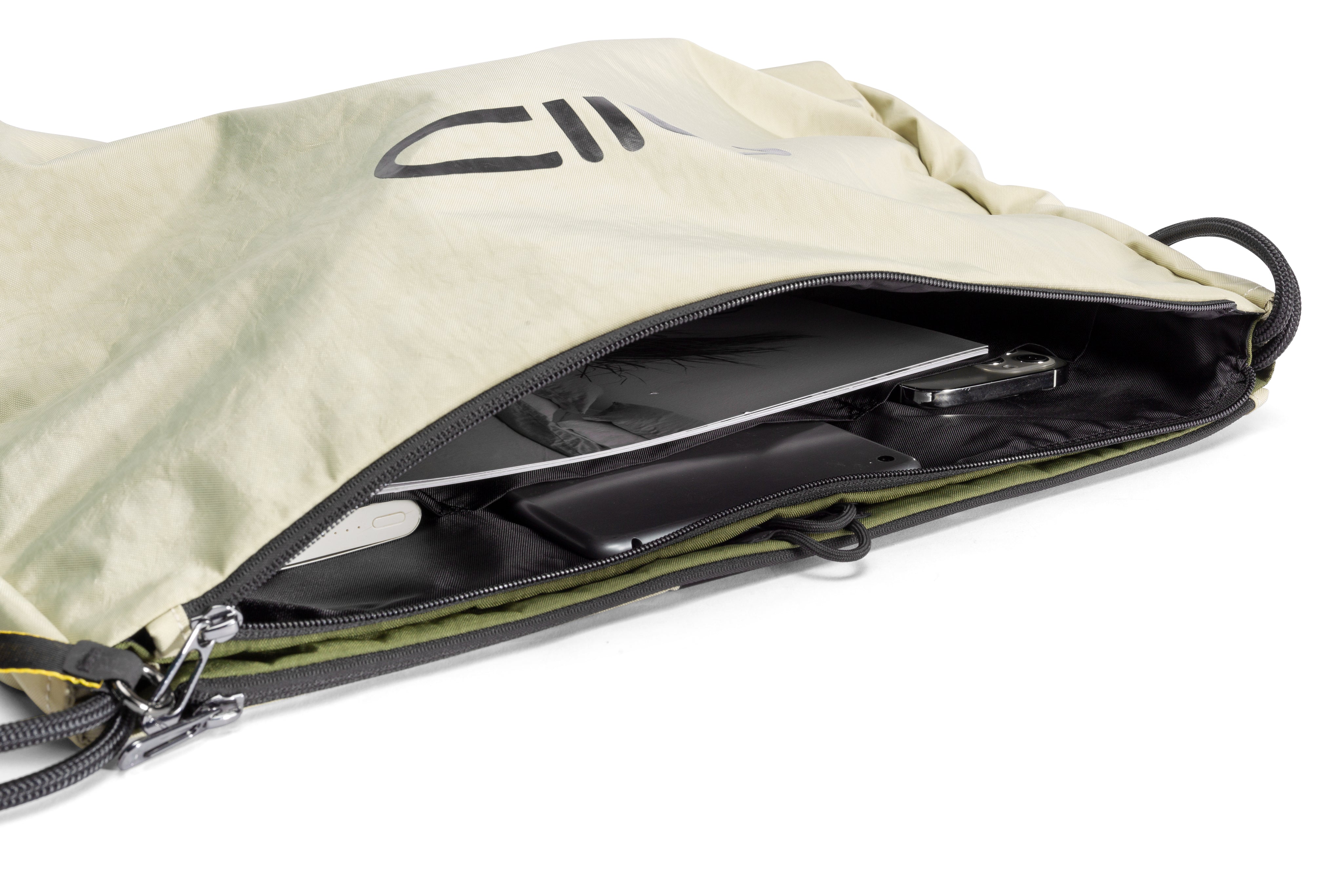 NIID ST@TEMENT S7 Tote Bag Khaki/Olive closeup of metal strap hardware and dual zipper, compartment storage demo with daily gadgets inside on white background.