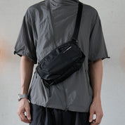 NIID NEO Nomad 4L Sling Bag‑N1 Diamond Grid Black, model wearing crossbody sling bag for everyday carry