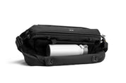 NIID S6 Hybrid Sling Statement Black side view, showing side pocket storage with water bottle inside, plain white studio background
